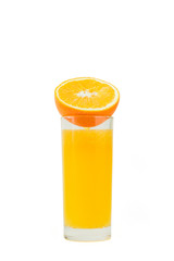 A cup of orange juice and cut orange on  white background.
