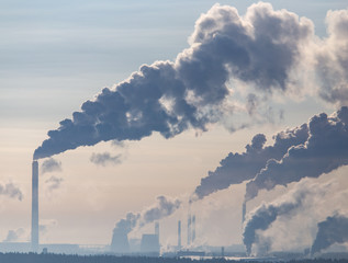 Smoke from the chimneys of a metallurgical plant at dawn