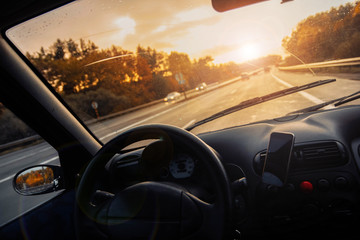 Obraz na płótnie Canvas Driving a car on a summer sunny day.