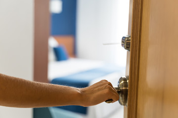 opening the door of a hotel room