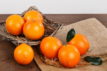 Fresh oranges on wooden table.