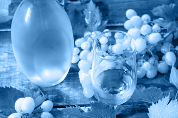 Classic blue 2020. Gradient color palette. Wine background. Wine in glasses, bottle, grapes on vintage background, wine concept.