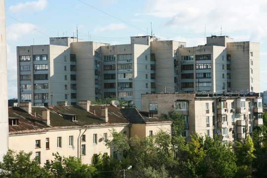 Soviet-built buildings built in different years of the 20th century in Russia. You can see the roofs of houses, balconies. Soviet architecture.