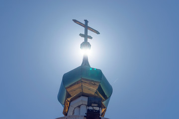Fototapeta na wymiar The Golden dome of the chapel against the blue sky.
