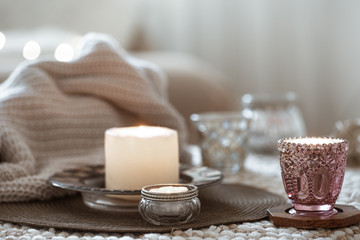 Still life with candles on the table in the living room.