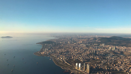 Aerial shot of Turkey's beautiful city Istanbul. Bosporus, sea and Turkish city from air, bird eye, in sunny day.