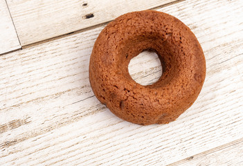 Chocolate chocolate donuts on a wooden background. Food is popular.