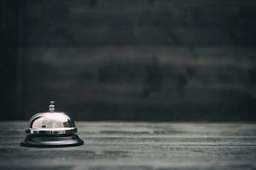 Hotel ring on black wooden  background