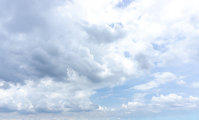 Beautiful white fluffy cloud formation on vivid blue sky in a sunny day