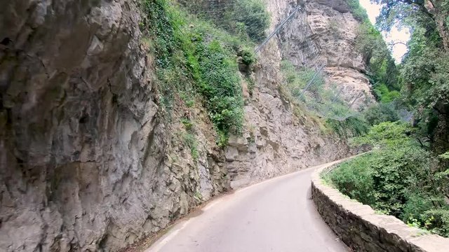 Garda lake, Italy. Driving along the Strada della Forra, one of the most scenic and famous drives in the world. Winston Churchill defined it as the eighth wonder of the world. Driver point of view