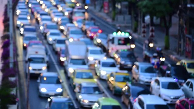 Bokeh abstract blurred background festive traffic yellow orange green red lights on road with sparkling circular animate motion 3D. Backdrop with twinkling bright shape blinking lights in modern city