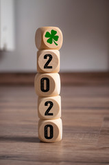 Cubes dice with Luck and shamrock or cloverleaf and 2020