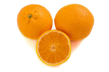 Three oranges isolated on a white background. Fresh citrus fruits.