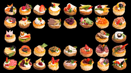 Assortment of tasty canapes on black background