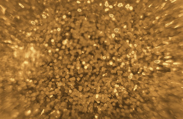 shiny festive blurred  golden background with sparkles closeup