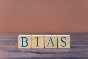 the word bias on wooden blocks blue text