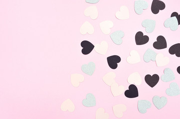 Can use for Valentines Day, Mothers day, Birthday. Pink, black and silver paper hearts on pink background with place for your text.