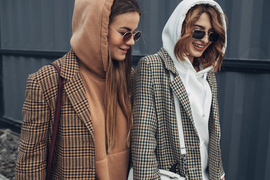 Portrait of Two Fashion Girls, Best Friends Outdoors, Wearing Stylish Jacket