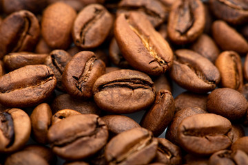 Fototapeta premium Coffee beans close-up background. Fresh roasted