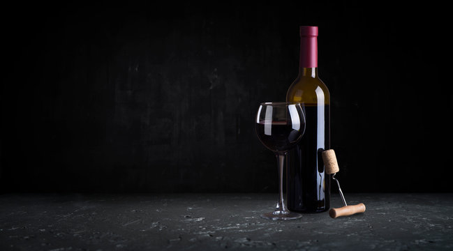 Red Wine Glasses And Bottle On Stone Background. Top View With Copy Space