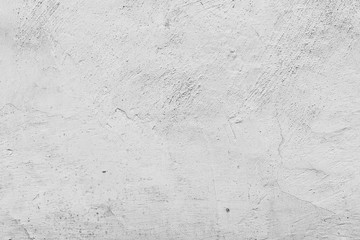 Texture of a concrete wall with cracks and scratches which can be used as a background