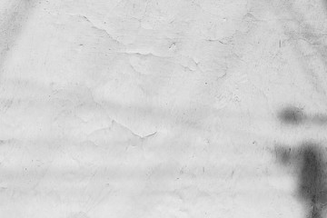 Texture of a concrete wall with cracks and scratches which can be used as a background