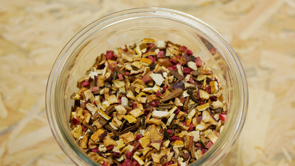 Herbal tea dried blend of rose glass jar cup, apple, lemon peel, cranberry, orange peel, star anise winter punch, cloves, cinnamon tea well decorative. Traditional folk medicine fruit, human health