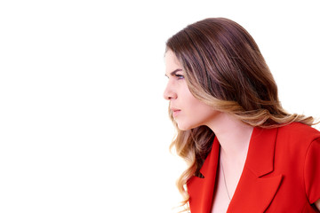 Serious young woman in a red costume on a white background.