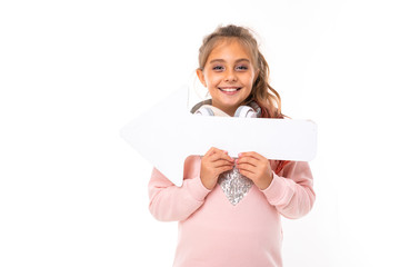 Little beautiful girl with brown hair holds a white card and smiles