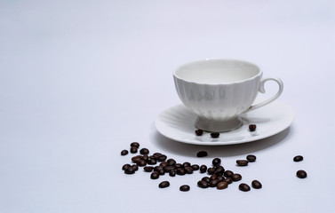 white empty coffee Cup with beans and a spoon