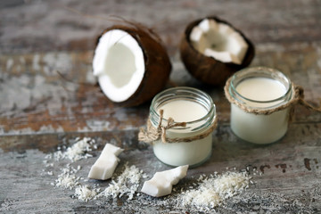 Obraz na płótnie Canvas Coconut Yogurt Vegan food. Coconut and coconut flakes. Macro.