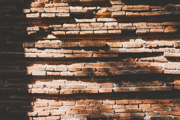 Brick wall texture background,Sun shine through brick background.Vintage Tone.