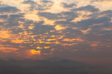 Beautiful sunrise on mountain. sky and cloudscape at sunrise. Sunrise in Thailand.
