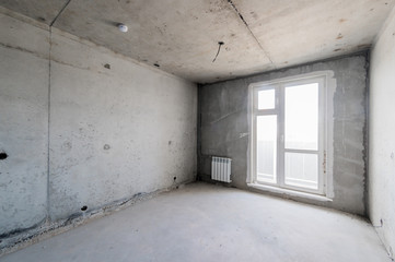 Russia, Moscow- August 05, 2019: interior room rough repair for self-finishing. interior decoration, bare walls of the room, stage of construction
