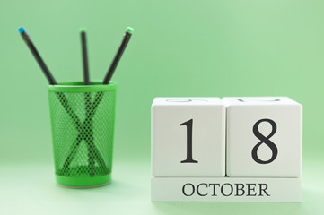 Desk calendar of two cubes for October 18