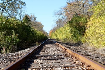 Obraz premium A low angle view of the long empty railroad tracks.