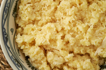 Minced garlic in ceramic bowl 
