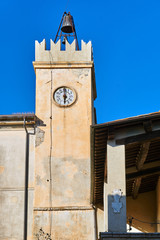 Historic clock tower in the city of Magliano in Toscana, Italy.