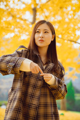 Autumn, girls and yellow gingko leaves