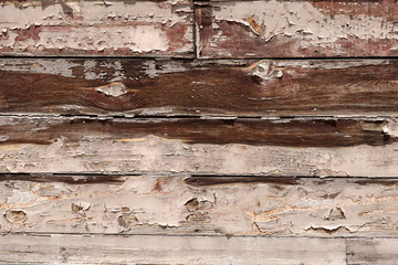 wall of wooden planks worn by time. Texture.