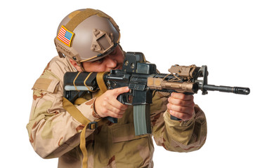 Airsoft player aiming with his rifle isolated on white