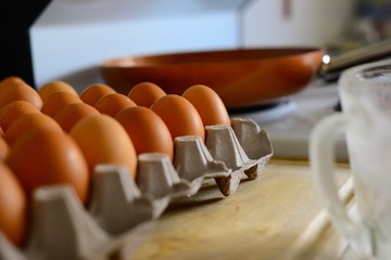 eggs in carton next to stove