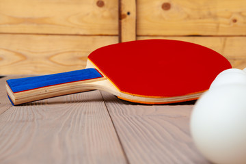 Ping pong equipment on wooden table close up