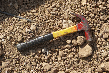 A hammer on the ground.