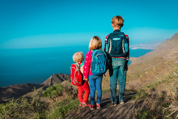 kids-boy and girls- travel in mountains near sea, family in Canary islands, Spain