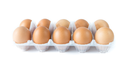 Studio shot a plastic tray with ten pastured raised chicken eggs isolate on white