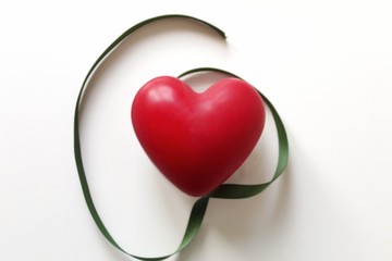 heart with red ribbon isolated on white