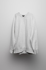 blank basic grey sweatshirt on grey background