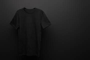 blank basic black t-shirt on black background