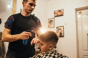 man getting trendy haircut at barber shop